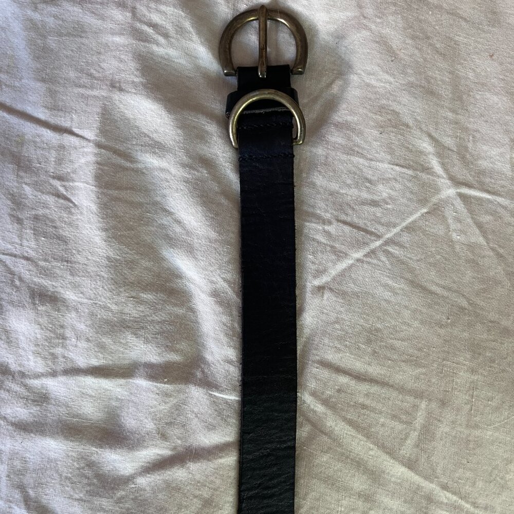 black leather belt with bronze buckle